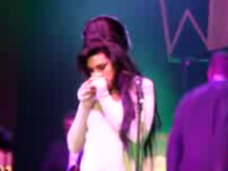 Is Amy Winehouse taking drugs on stage?