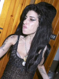 SEE PICS Amy Winehouse quizzed by police after alleged attack