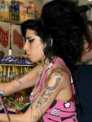 Amy Winehouse 'romancing another bloke in the Caribbean'