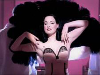 Dita Von Teese performs saucy striptease