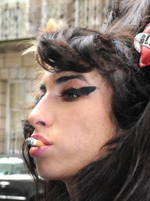 SEE PHOTOS Amy Winehouse - from shapely glamour girl to walking skeleton