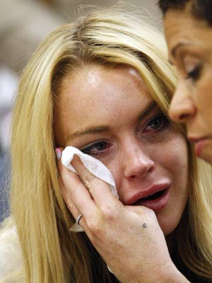 VIDEO Lindsay Lohan starts jail sentence in handcuffs
