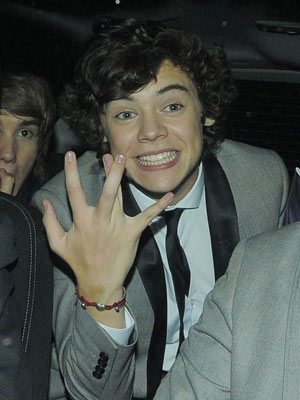 One Direction's Harry Styles leaves London club with stunning teen model Cara Delevingne