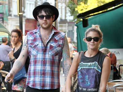 X Factor's Katie Waissel enjoys the sun with her dogs in London