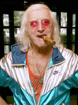 Jimmy Savile's family have his �4,000 headstone ripped out in the middle of the night