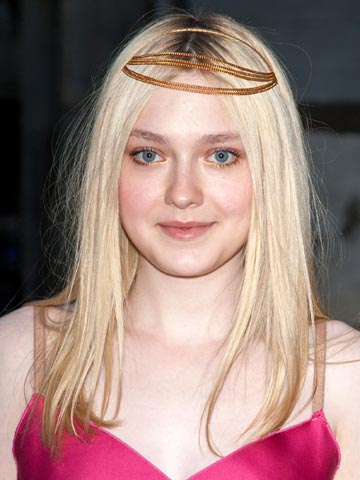 What is Dakota Fanning wearing on her head?