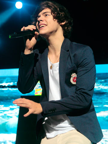 Steal Harry Styles' cross-dressing look with a blazer and breast pocket badge