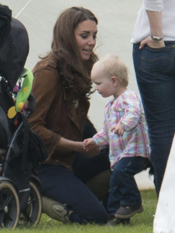 Kate Middleton falls for baby girl as she takes puppy Lupo to watch Prince William in charity polo match