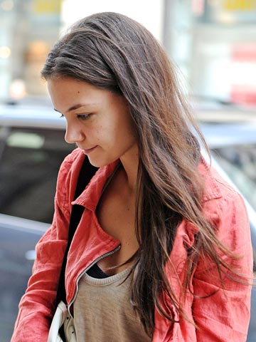 Cheer up, Katie Holmes! Actress looks glum as she steps out in New York without daughter Suri Cruise