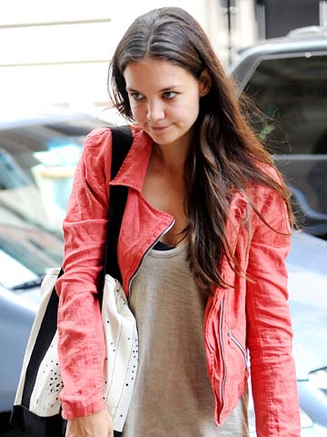 Katie Holmes heads to a New York gym while daughter Suri spends time with Tom Cruise