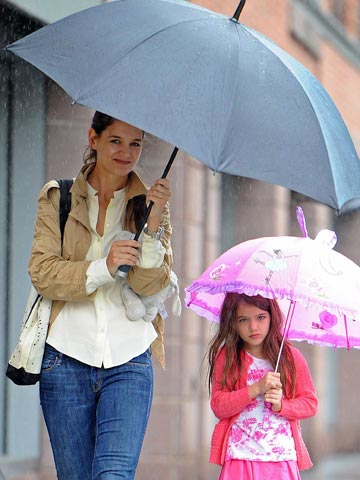 Katie Holmes braves the rain in New York with daughter Suri Cruise