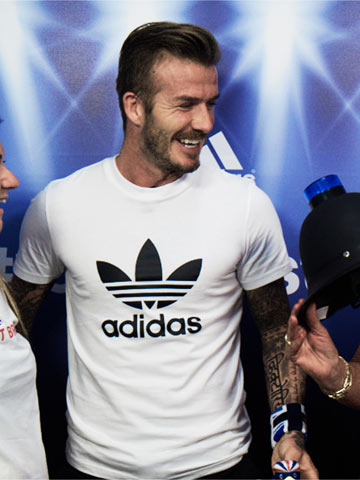 VIDEO David Beckham surprises shoppers in London as he jumps into Olympics-themed photo booth