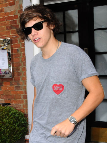 Harry Styles shows off new ink on his collarbone - and plans to get his arm covered in tattoo sleeve