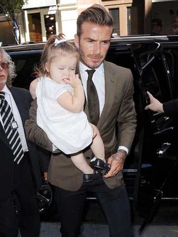 David Beckham brings daughter Harper along to show support at Victoria Beckham Collection launch