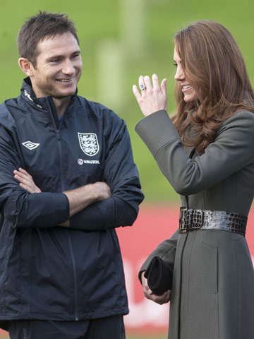 Kate Middleton recycles Reiss coat to meet England football team at launch event with Prince William