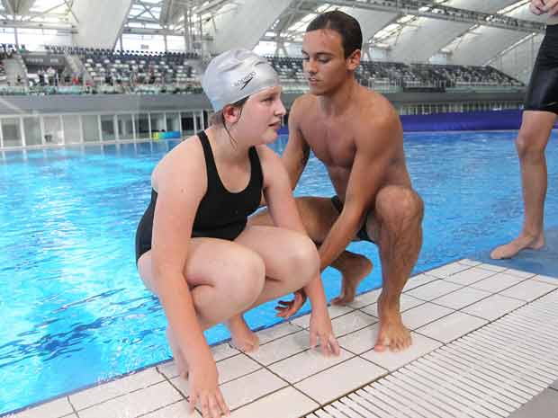 Sexy Team GB Olympic star Tom Daley reveals hot body at diving lesson in China