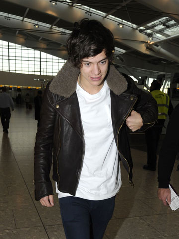 Tattoo fever! One Direction's Harry Styles has gigantic butterfly tattoo inked across his stomach 