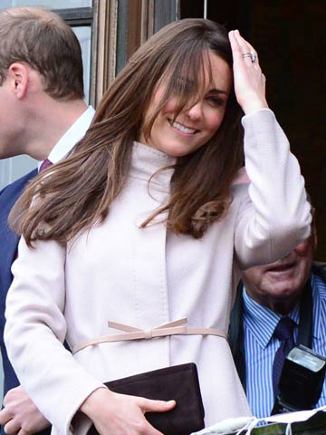 Kate Middleton battles to keep new hair in place on windy Cambridge visit with Prince William