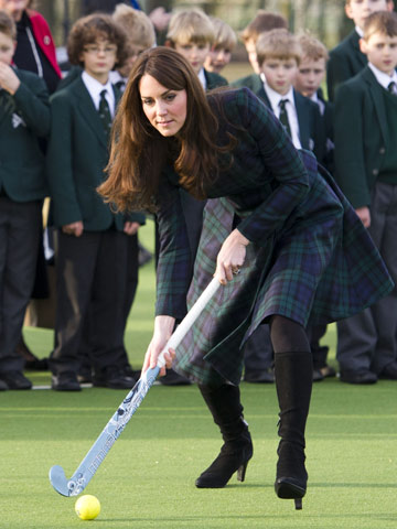 Kate 'Squeak' Middleton plays hockey in high heels on visit to old school without Prince William 