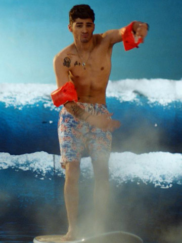 One Direction strip off, dress up and get locked up in Kiss You music video 