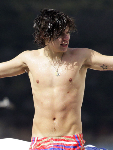 One Direction's Harry Styles is hot but his tattoos are not! ALERT: Topless Harry pictures