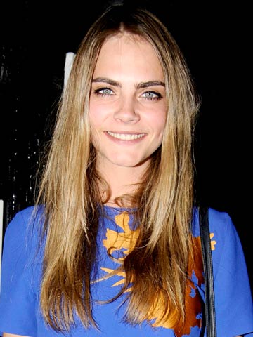 Harry Styles' ex-squeeze Cara Delevingne and Rita Ora pucker up in the name of fashion