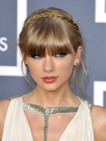 Taylor Swift gets her hair in a twist over Harry Styles at Grammys