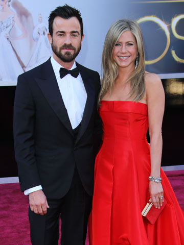 Has Jennifer Aniston postponed her wedding to Justin Theroux?