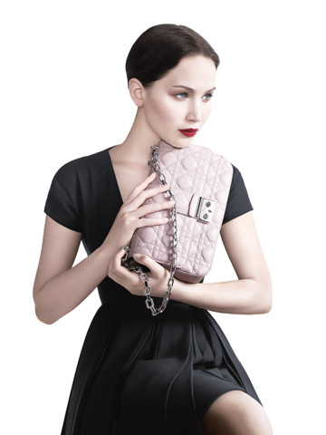 SHOCK! Jennifer Lawrence models A-list Dior arm candy and avoids disaster - so far