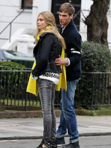 Look away, Harry Styles! Cara Delevingne flirts with boys at London photoshoot 