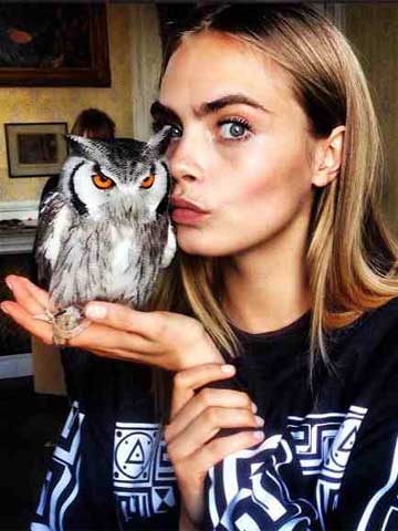 Don't look now, Harry Styles! Cara Delevingne kisses a bird - and it's not 'wifey' Rita Ora