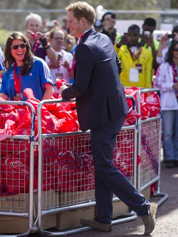 Prince Harry joins stars and meets race winners at London Marathon 2013