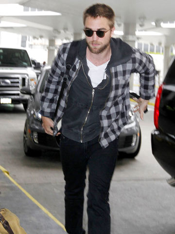 Robert Pattinson sports sexy stubble as he steps out New York without Kristen Stewart