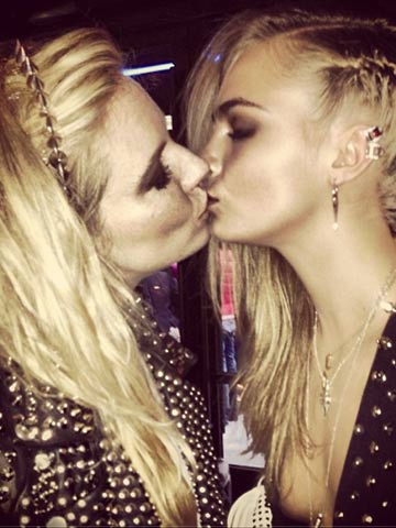 Don't look now, Rita Ora! Cara Delevingne shares sexy kiss with Sienna Miller at Met Ball