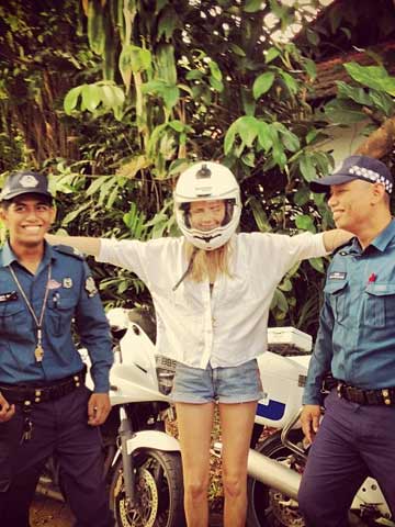 Cara Delevingne shows off sexy legs in tiny shorts on Singapore shoot