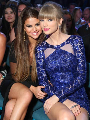No tongues please! Taylor Swift makes 'ugh' face as Selena Gomez and Justin Bieber kiss at Billboard Music Awards