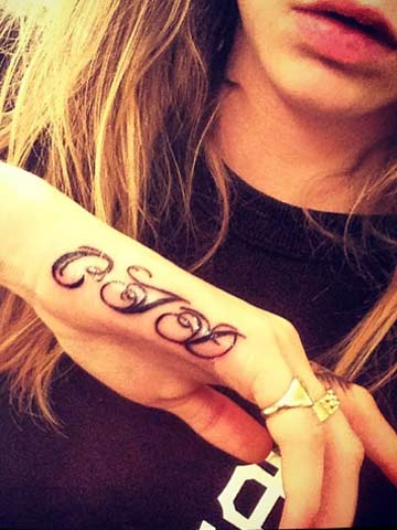 Rihanna's 'lover' Cara Delevingne gets tagged again with second tattoo