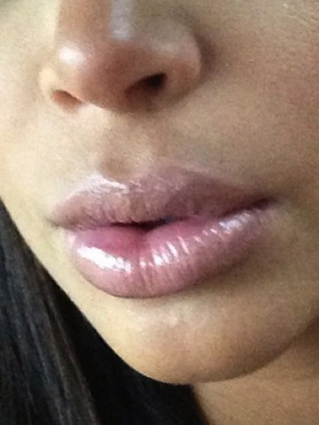 How pregnant Kim Kardashian's sexy lips have grown to match her bump. Wow!