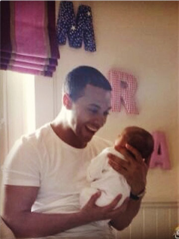 AW! JLS star Marvin Humes looks adoringly at his and Rochelle Wiseman's new baby daughter in cute first picture