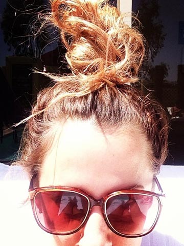 Caroline Flack twists hair into 'rooftop topknot' after partying with Laura Whitmore at Coachella Caroline Flack twists hair into 'rooftop topknot' after partying with Laura Whitmore at Coachella